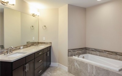 The sumptuous 5-piece master bath has dual sinks with Pental qua