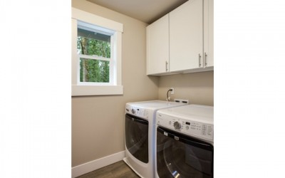 Upper level utility room is convenient to the master suite and b